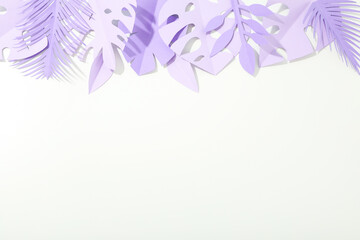 Paper exotic leaves on white background, space for text