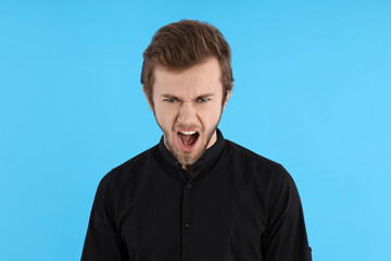 Obraz premium Concept of people, young man on blue background
