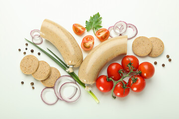 Composition of tasty food with liverwurst sausage on white background