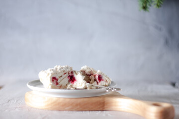 Fototapeta na wymiar homemade meringue roll with cream and strawberries