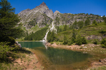 Summer view of Italy Piedmont Alpe Devero Natural Park Lake of Devero with the peaks of Pizzo Crampiolo