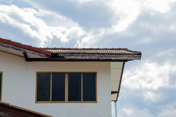 Old damaged brown asphalt composition shingle roof
