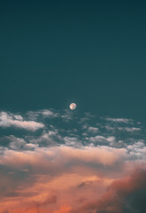 Picturesque photo of subtle moon in the evening sky
