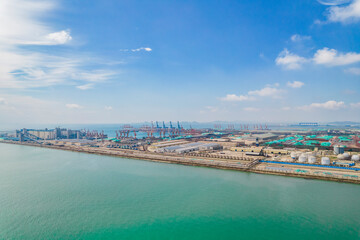 Fototapeta premium Aerial shot of seaside industrial plant
