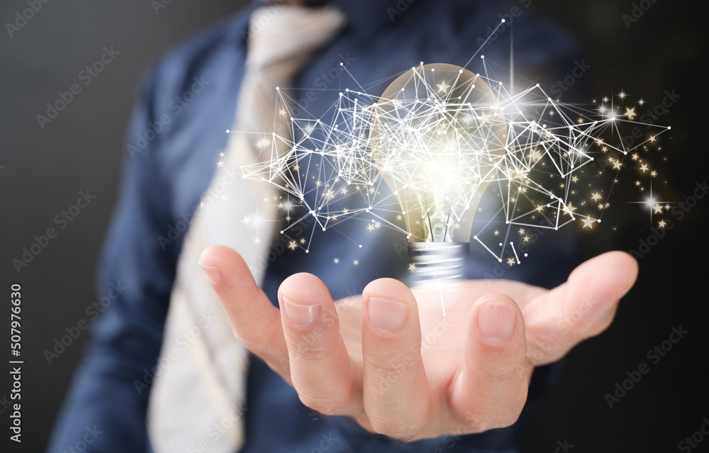 Poster hands holding a light bulb to represent an idea notion with innovation and inspiration, inventive sc