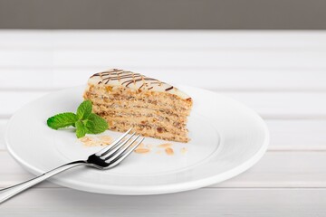 A piece of sponge cake decorated on a plate