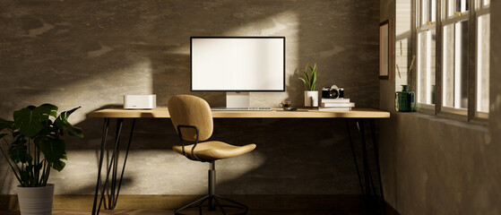 Modern loft office desk workspace with pc computer on wood table over loft cement wall.