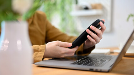 Close-up image, Female hands holding a smartphone, using cellphone, texting