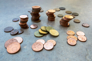 shiny euro coins and coin piles on the ground