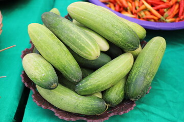 fresh cucumber on the green table 