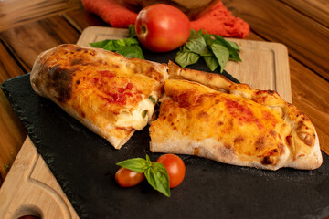 Homemade calzone with a wood table