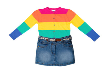Girls clothing. Beautiful cute blue little kids denim skirt and a fashionable rainbow colored jumper or sweater isolated on a white background. Spring and summer fashion.
