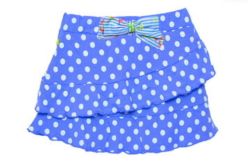 Summer skirt isolated. Closeup of a beautiful blue little girl short polka dot skirt with a colorful bow isolated on a white background. Children and kids fashion. Macro.