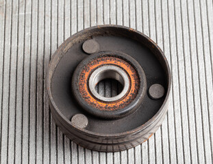 Old bypass car roller. Roller jamming, close-up