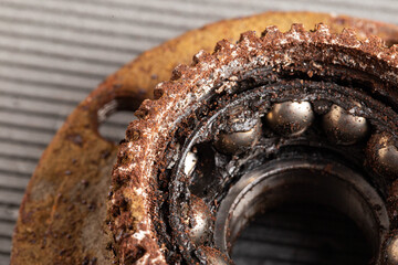 Old rusty wheel hub with a broken bearing. Bearing jamming. Automotive Part, close-up.