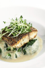seabass with mashed potato and broccoli in a creamy dijon mustard sauce
