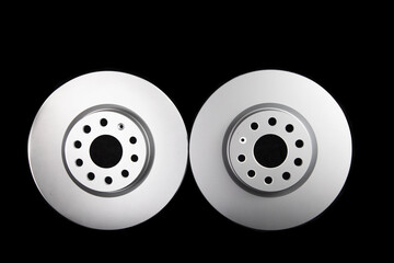 White brake discs on a black background. Efficient braking, safety. Close-up