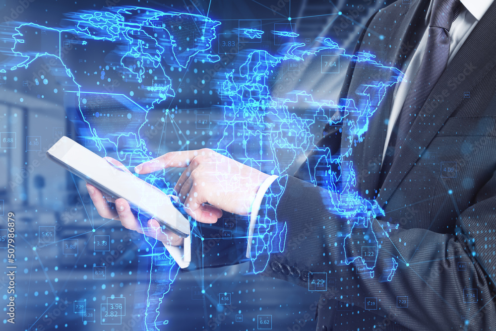 Poster close up of businessman using tablet with glowing blue map hud screen and digital data concept on bl