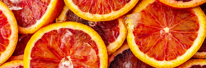 Fruit banner with blood oranges and ice, delicious sweet fruit, top view