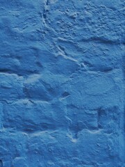 Peinture bleue sur un vieux mur de briques maçonné