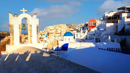 Beautiful view of   look out  with  sunset sky scene background  and blue dome church  at Oia village, Santorini,Greec