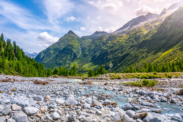 Wild rocky river in alpine valley