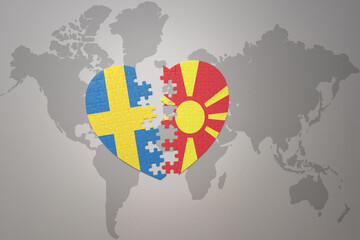 puzzle heart with the national flag of sweden and macedonia on a world map background. Concept.