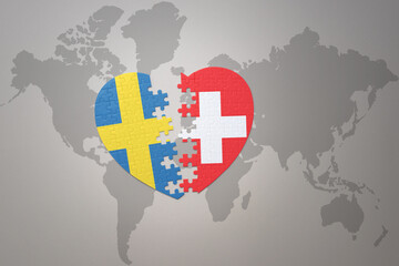 puzzle heart with the national flag of sweden and switzerland on a world map background. Concept.