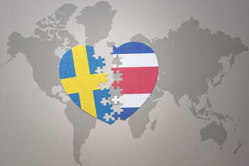 puzzle heart with the national flag of sweden and costa rica on a world map background. Concept.