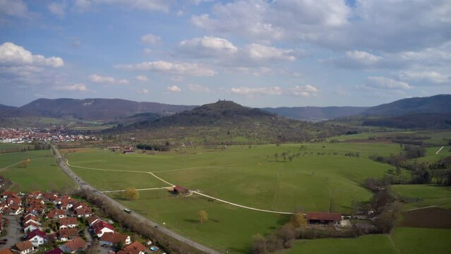 Time lapse drone POV shadows of clouds over hills and town, Kirchheim, Germany
