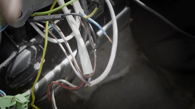 Soldering wires with a gas soldering iron, close-up.