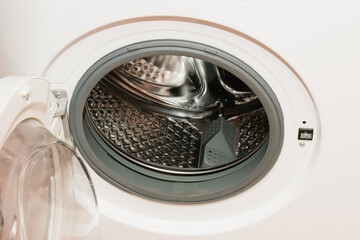 White washing machine, drum washing machine close up