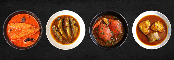Assorted Indian seafood dishes. Bangda Fry, Crabs, Prawns and pomfret curry, Tandlachi Bhakri, Rice, and gulab jamun. along with green chutney and salad. Copy space. Malwani fish thali. Maharashtrian 