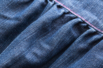 Naklejka premium Blue denim, background. Stylish jeans, macro, design