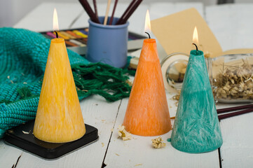 Three conic candles close-up