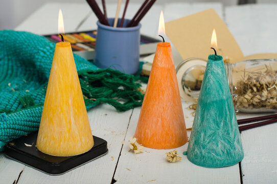 Three conic candles close-up