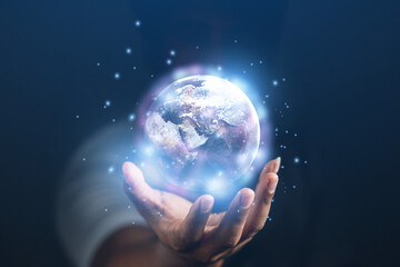 concept of future world technology By the earth in the hands of man. Earth day. Energy saving concept. Elements of this image furnished by NASA.	