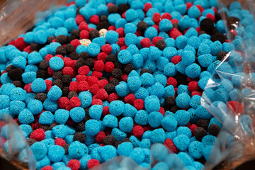 Candy sweets jelly. Close up view of delicious sweet candies in form of berries. Fruit jelly in shop window. Sweets for Easter, Halloween. Unhealthy or organic food. Selective focus 