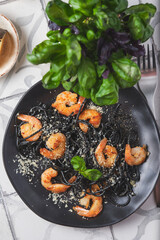 Black shrimp pasta with olive oil and parmesan.