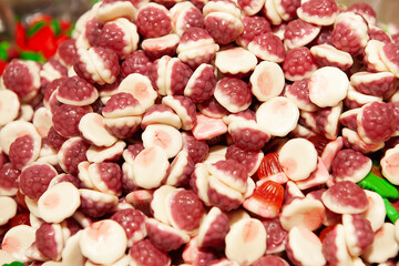 Candy sweets jelly. Close up view of delicious sweet candies in form of berries. Fruit jelly in shop window. Sweets for Easter, Halloween. Unhealthy or organic food. Selective focus. Top view 