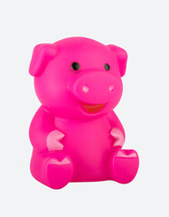 Pink rubber baby toy pig on a white background