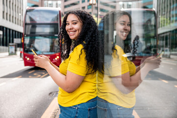 Happy woman at bus stop in the city - 507997654