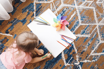 cute little girl drawing at home - 507997861