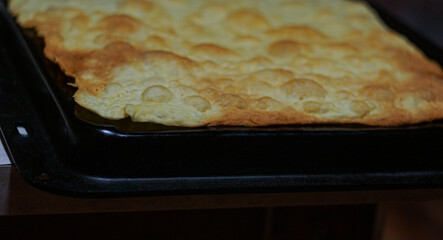 uncooked pastry in an iron pan