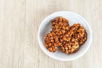 Ampyang Kacang or Gula Kacang, Indonesian traditional snack, made from peanuts and brown sugar. The taste of this snack is very sweet.
