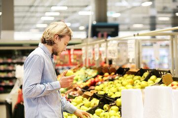 Man buying fruits at the market