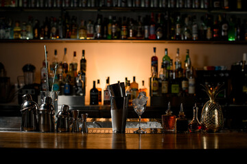 beautiful composition with bar equipment and steel tools which stand on bar counter.