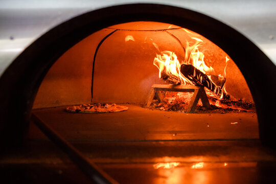 Pizza is cooked in the oven © tsezarina