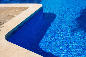 Detail of the curved corners of a swimming pool, designed for comfort.