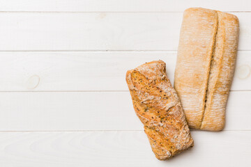 Homemade natural breads. Different kinds of fresh bread as background, top view with copy space